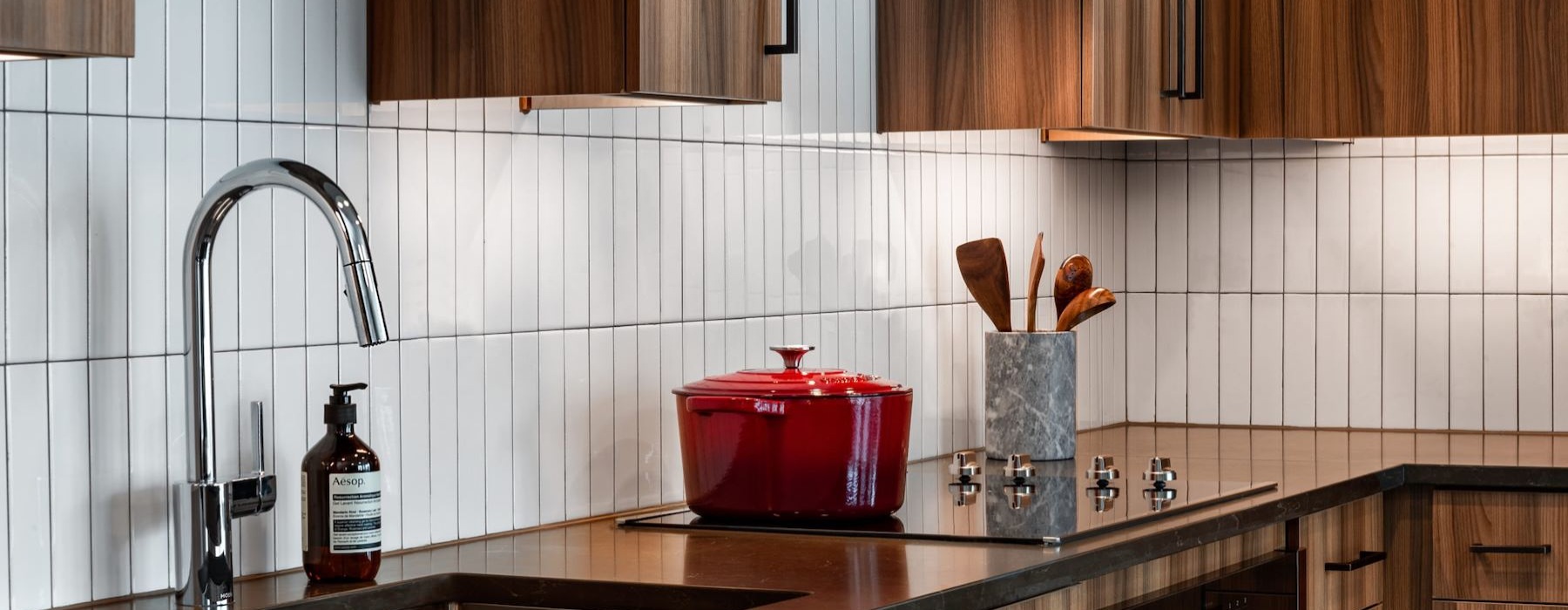 a kitchen with a sink and a faucet