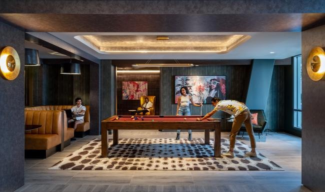 a person playing pool in a room